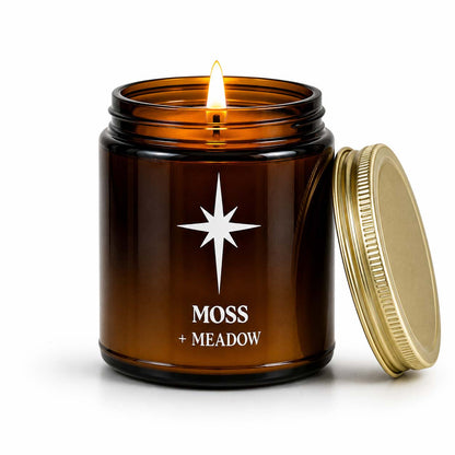 Moss and Meadow Scented Candle with flame