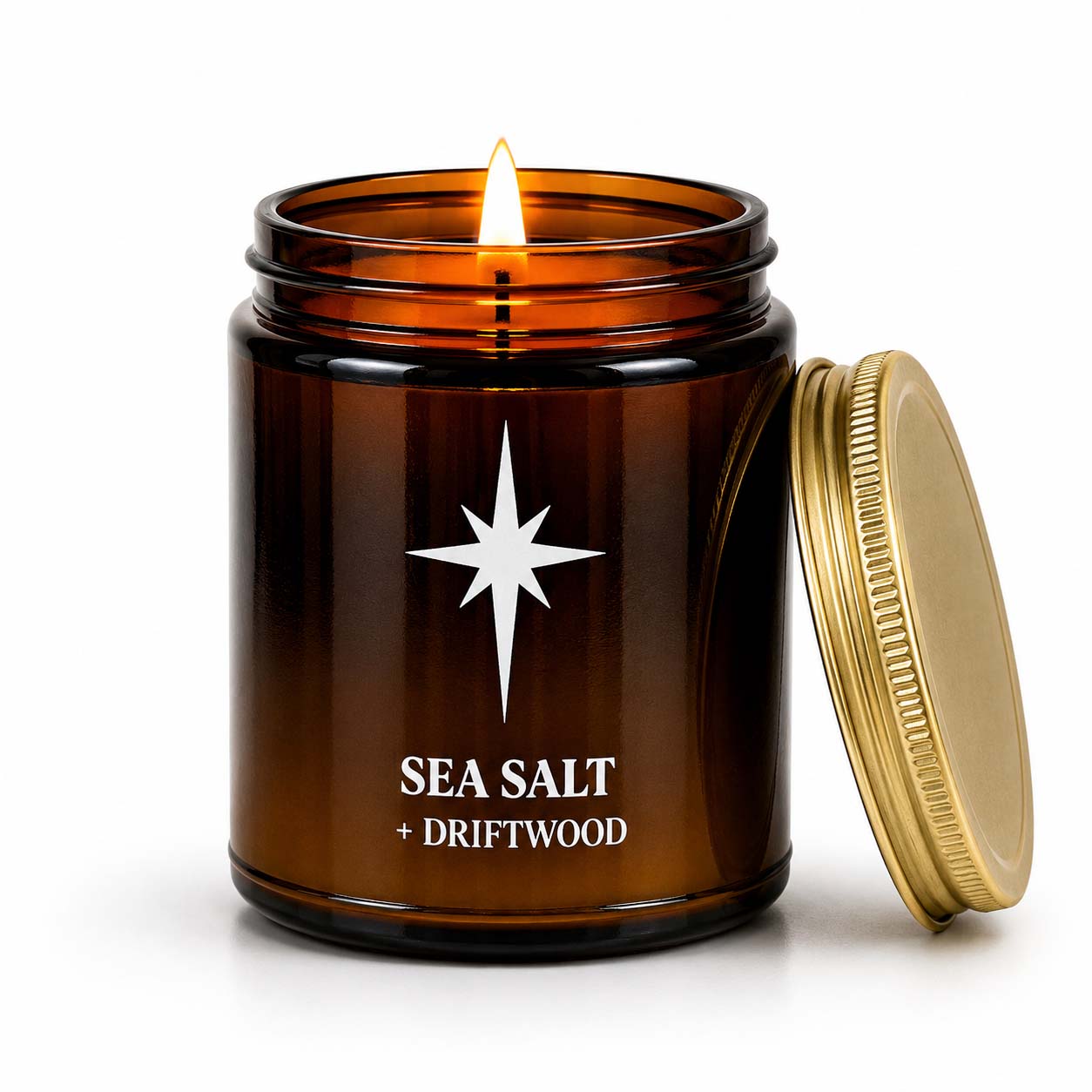 Sea Salt and Driftwood Scented Candle with flame