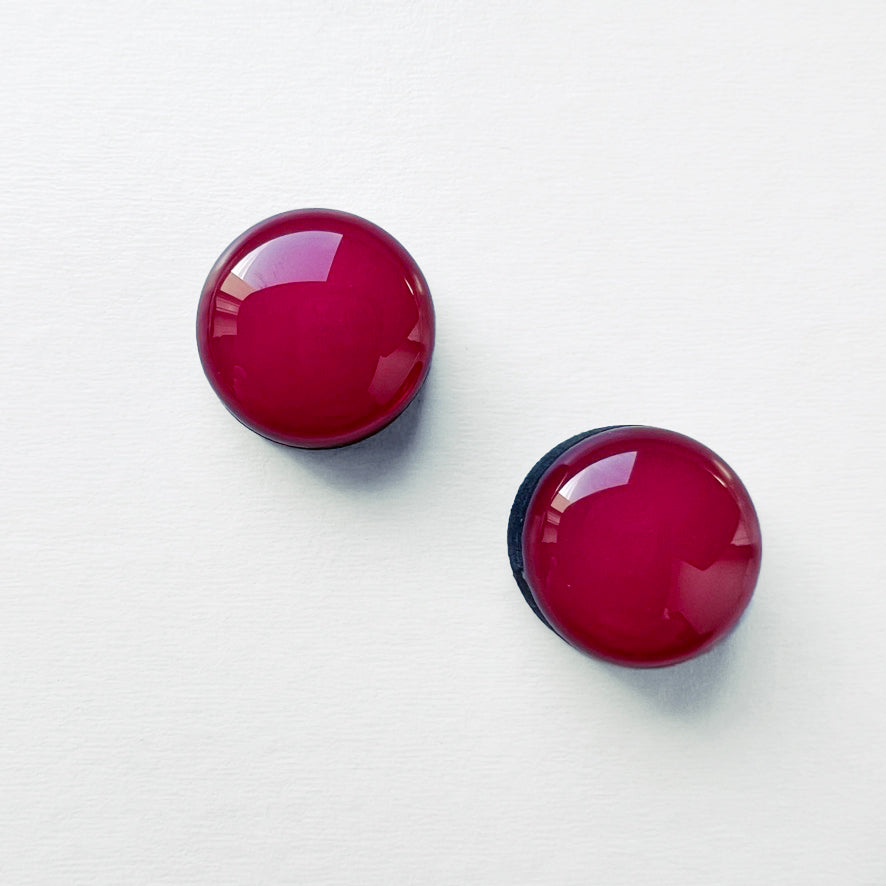 Handmade painted Magenta wood stud earrings with a resin finish. Hypoallergenic titanium posts. Geometric style circle